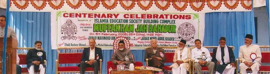 Guests seated on stage at an Islamia Education Society celebration